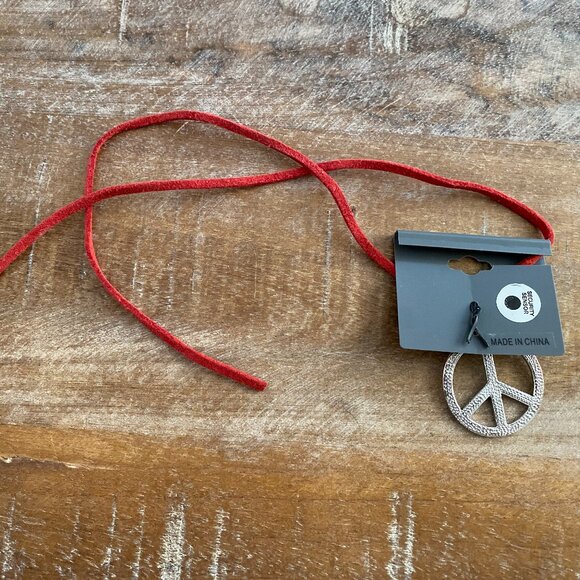 Never used enamel Peace Sign Necklace on a red cord. - Picture 2 of 2